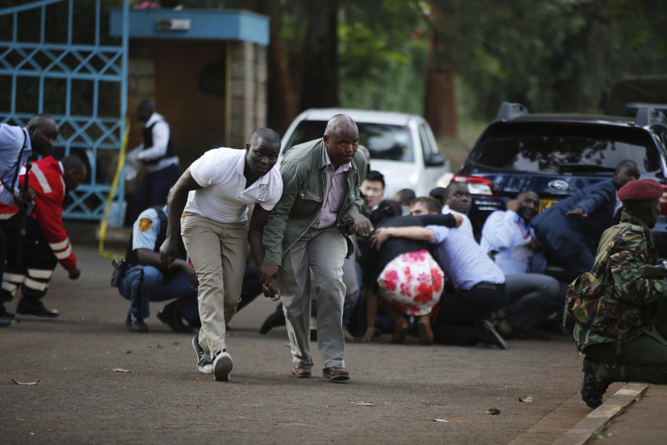 People take cover after an attack on a hotel in Nairobi, Kenya, Jan. 15, 2019. (Photo: Brian Inganga/AP)