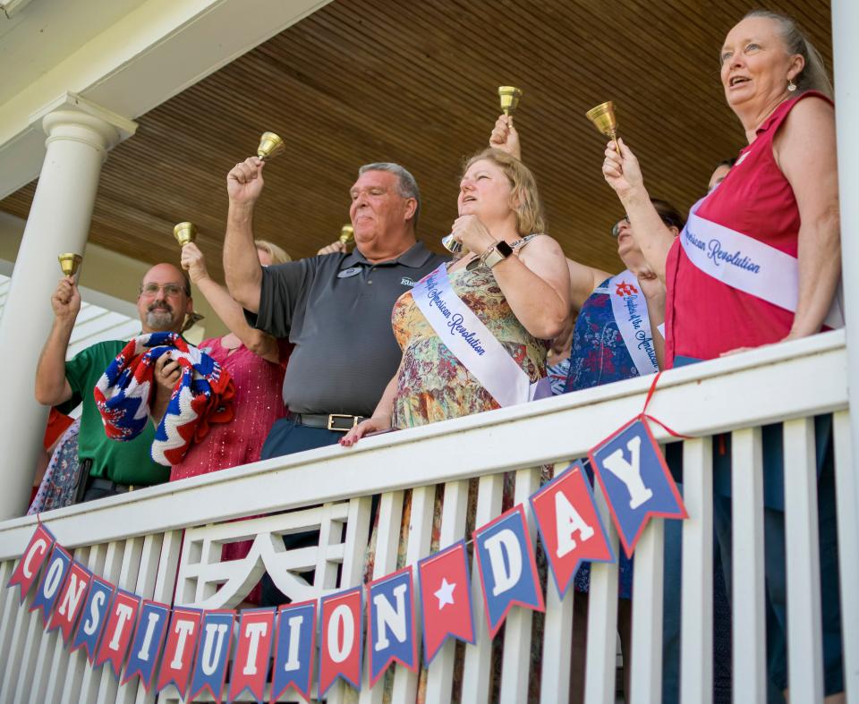 People ring bells at 4 p.m. on Sept. 17 to mark the 236th anniversary of the signing of the U.S. Constitution at the Eustis Historical Museum in Eustis.