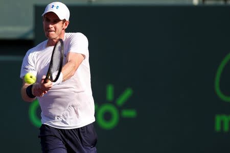 Andy Murray hits a backhand against Dominic Thiem (not pictured) on day ten of the Miami Open at Crandon Park Tennis Center. Murray won 3-6, 6-4, 6-1. Mandatory Credit: Geoff Burke-USA TODAY Sports