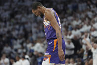 Phoenix Suns forward Kevin Durant walks across the court during the first half of Game 1 of an NBA basketball first-round playoff series against the Minnesota Timberwolves, Saturday, April 20, 2024, in Minneapolis. (AP Photo/Abbie Parr)