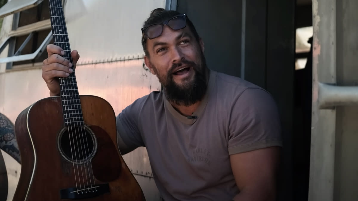  Jason Momoa holding the first 1934 Martin D-28. 