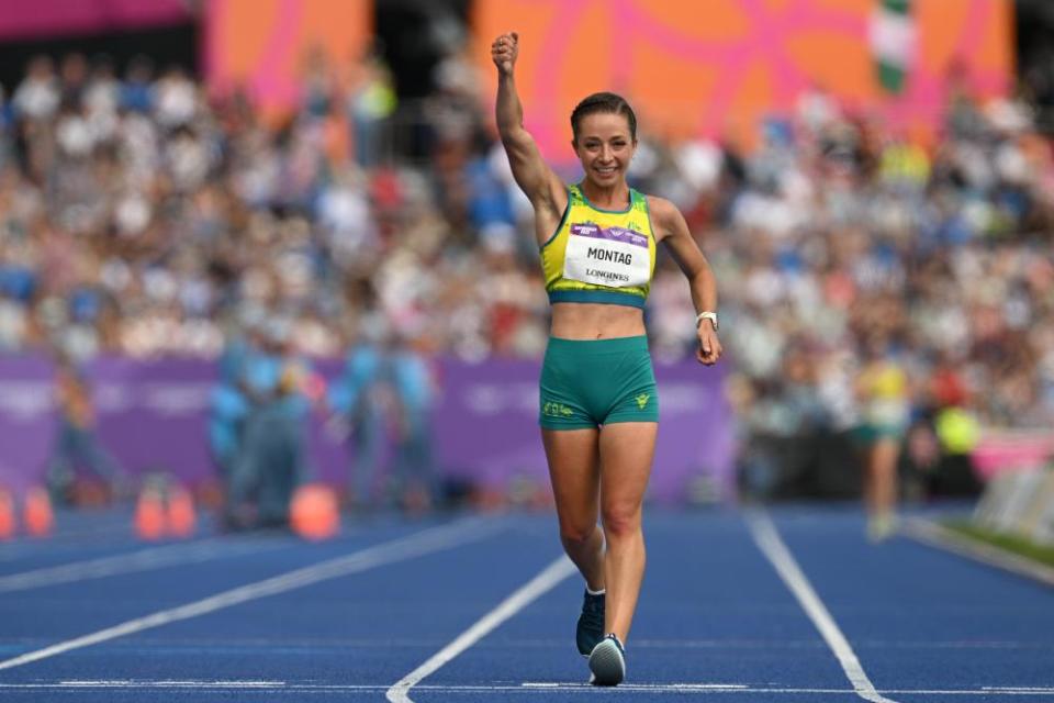 Jemima Montag crosses the finish line at Alexander Stadium.