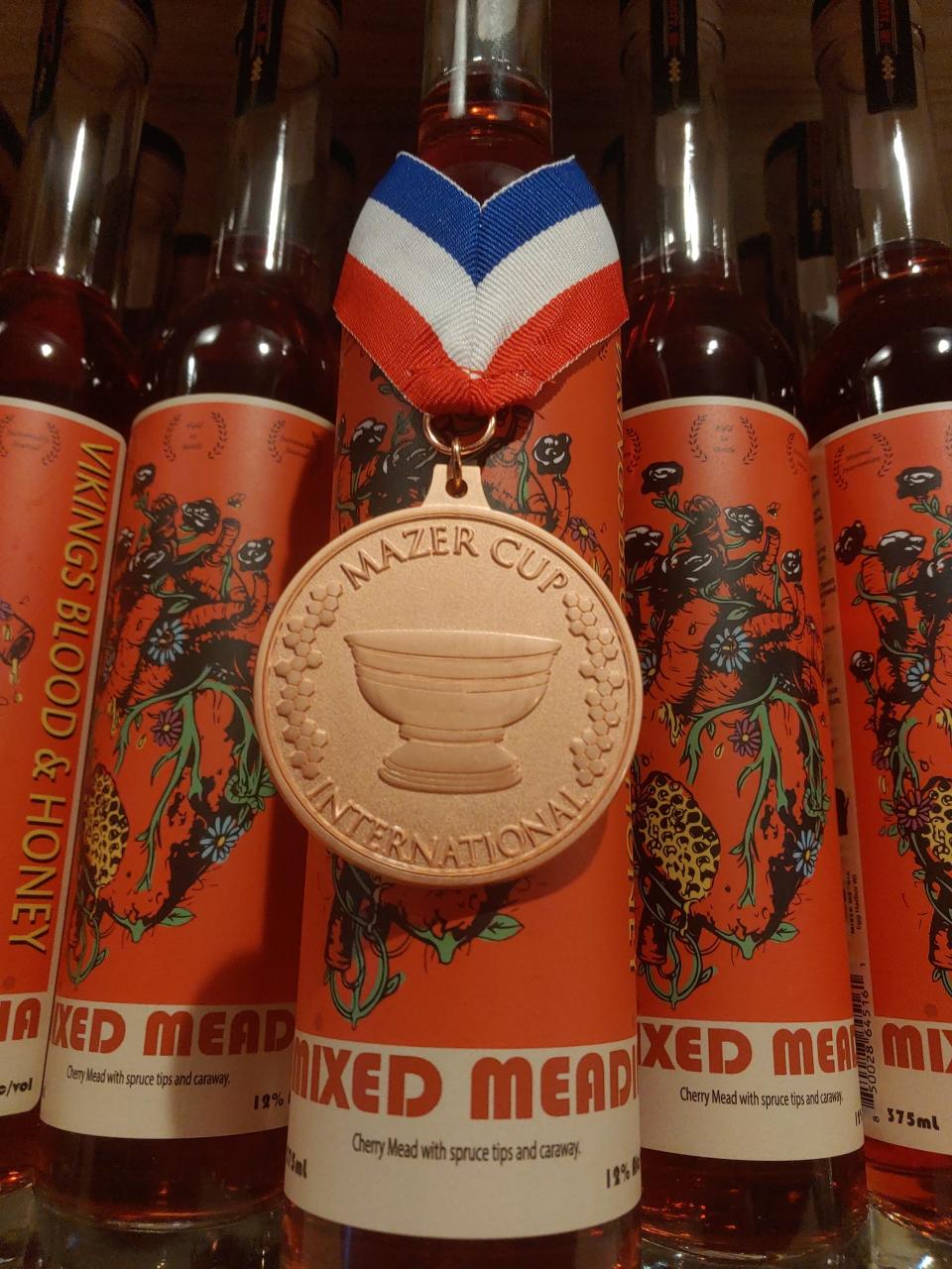 A bottle of Blood and Honey mead, made with all Door County-sourced ingredients, by Mixed Meadia of Egg Harbor shows off the bronze medal it won in the prestigious Mazer Cup Mead Competition.