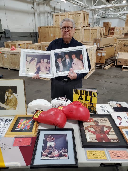 Paul Jancha, former attorney for Muhammad Ali, displays several of the signed items in his collection that went to auction on April 21, 2024. (AuctionMonthly)