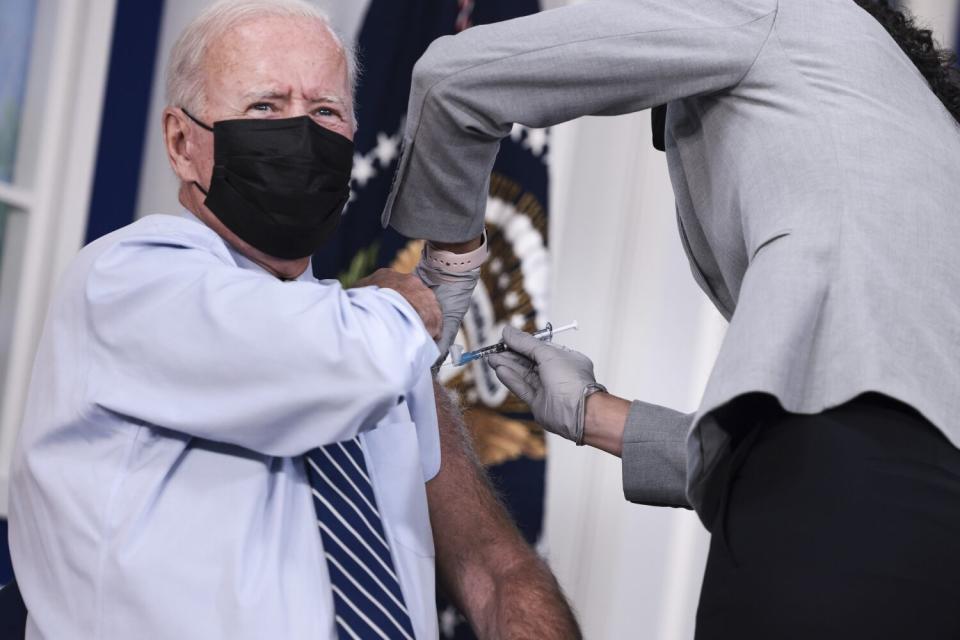 President Biden receives a booster dose of COVID-19 vaccine at the White House in September.