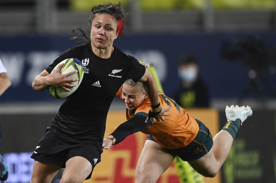 Ruby Tui of New Zealand runs at the defense during the Women's Rugby World Cup pool match between Australia and New Zealand, at Eden Park, Auckland, New Zealand, Saturday, Oct.8. 2022. (Andrew Cornaga/Photosport via AP)