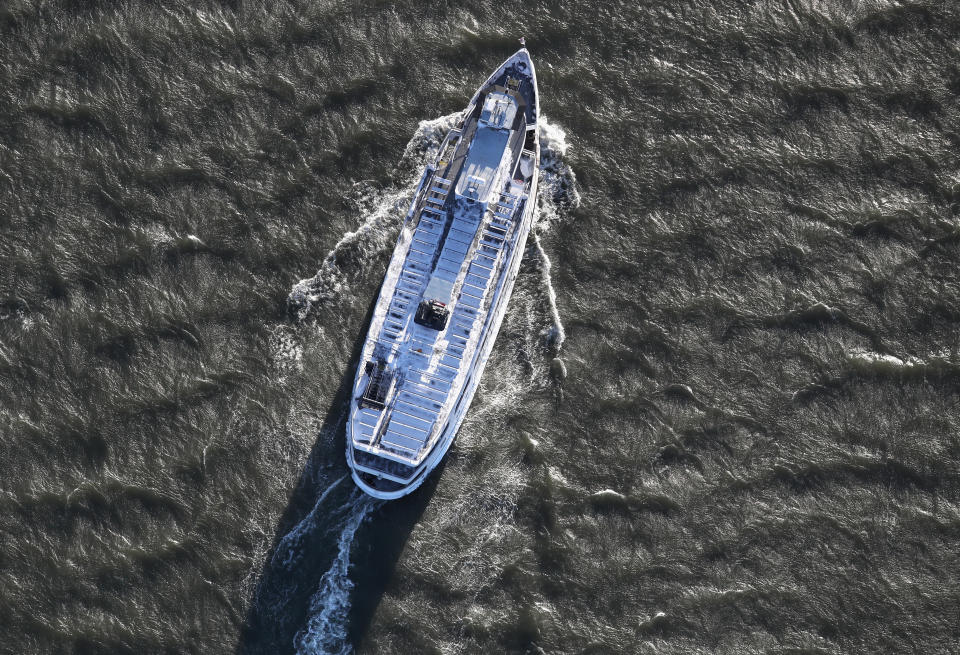 &nbsp;A snow-covered tour ferry rides past Liberty Island in New York Harbor on January 5, 2018 in New York City.&nbsp;