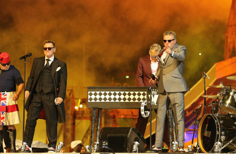 LONDON, ENGLAND - AUGUST 12: Chas Smash and Lead singer Graham ?Suggs? McPherson of Madness during the Closing Ceremony on Day 16 of the London 2012 Olympic Games at Olympic Stadium on August 12, 2012 in London, England. (Photo by Scott Heavey/Getty Images)