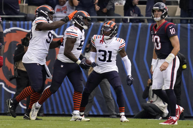 Chicago Bears' Khalil Herbert celebrates his touchdown with Justin