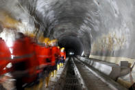 Visitors walk through the construction site of the NEAT Gotthard Base Tunnel at the Erstfeld-Amsteg section October 5, 2010. With a length of 57 km (35 miles) crossing the Alps, the world's longest train tunnel should become operational at the end of 2017.