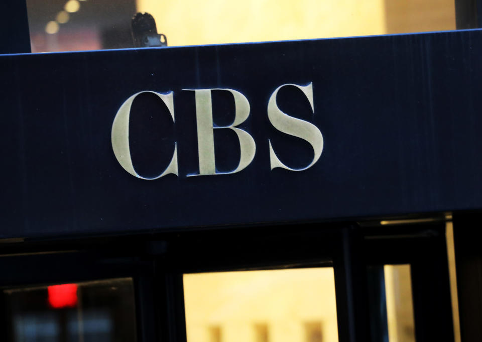 FILE - This Dec. 6, 2018, file photo shows the CBS logo at the entrance to its headquarters, in New York. The CBS game "Survivor" ends its 39th edition this week reeling from controversy over its first-ever forced removal of a contestant, a Hollywood agent sent packing after young women complained about inappropriate touching. (AP Photo/Mark Lennihan, File)