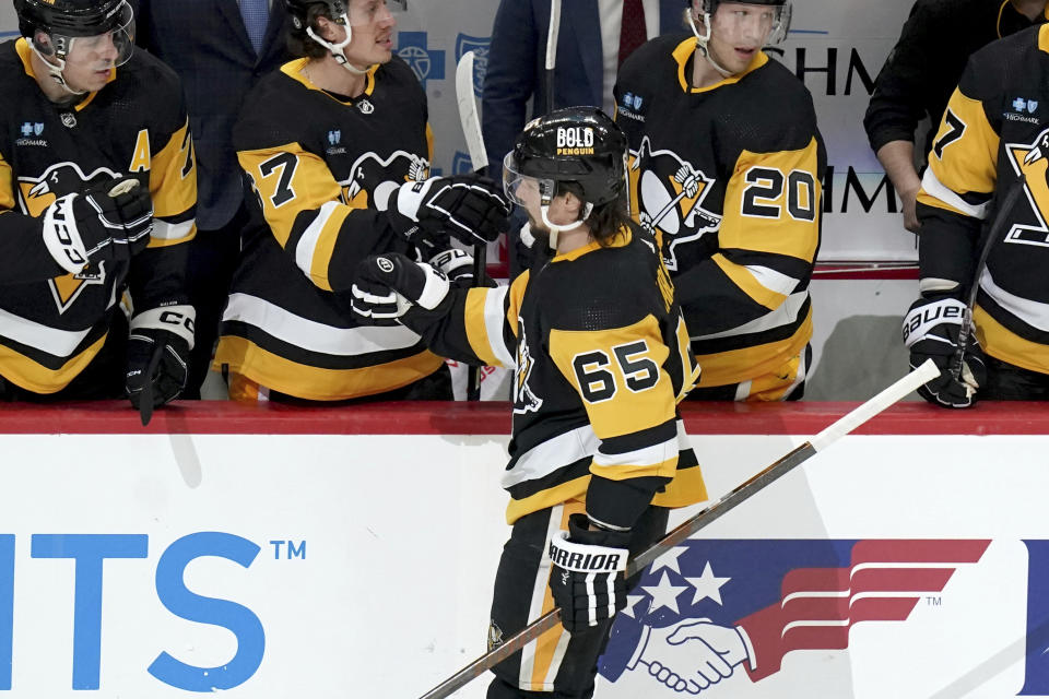 Pittsburgh Penguins' Erik Karlsson (65) returns to the bench after scoring against the Nashville Predators during the first period of an NHL hockey game, Monday, April 15, 2024, in Pittsburgh. (AP Photo/Matt Freed)