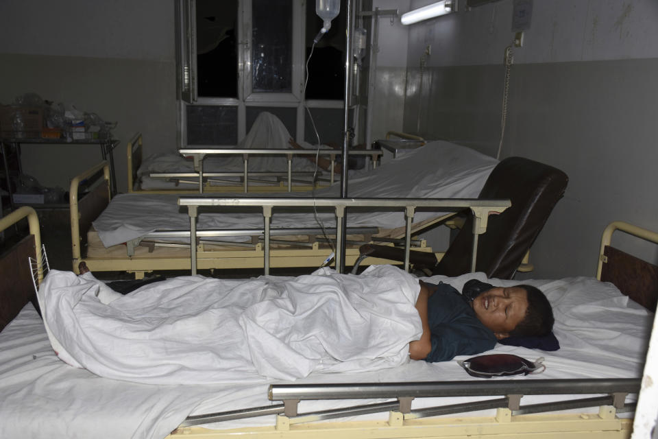 A wounded boy receives treatment in a hospital, after a bombing in Mazar-e-Sharif, northern Afghanistan, Wednesday, May 25, 2022. A series of explosions shook Afghanistan on Wednesday, the Taliban said, including a blast inside a mosque in the capital of Kabul that killed at least five worshippers and three bombings of minivans in the country's north that killed nine passengers. (AP Photo/Masih Paeiz)