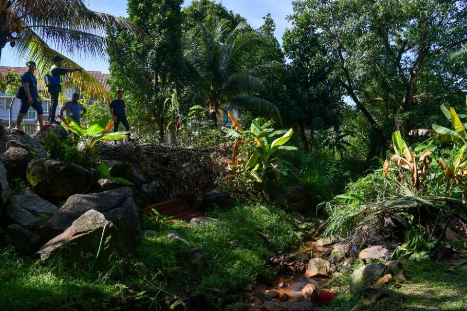 File picture of policemen at the location where the body of Zayn Rayyan Abdul Matiin, 6, was found, in an effort to gather new evidence to track down the killer of the autistic child, 200 metres from his residence in Apartment Idaman, Damansara Damai, December 8, 2023. — Bernama pic