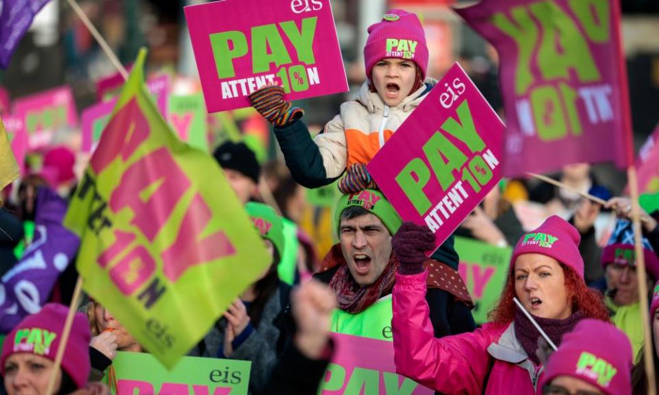 Striking teachers and supporters hold a rally on the Mound in Edinburgh