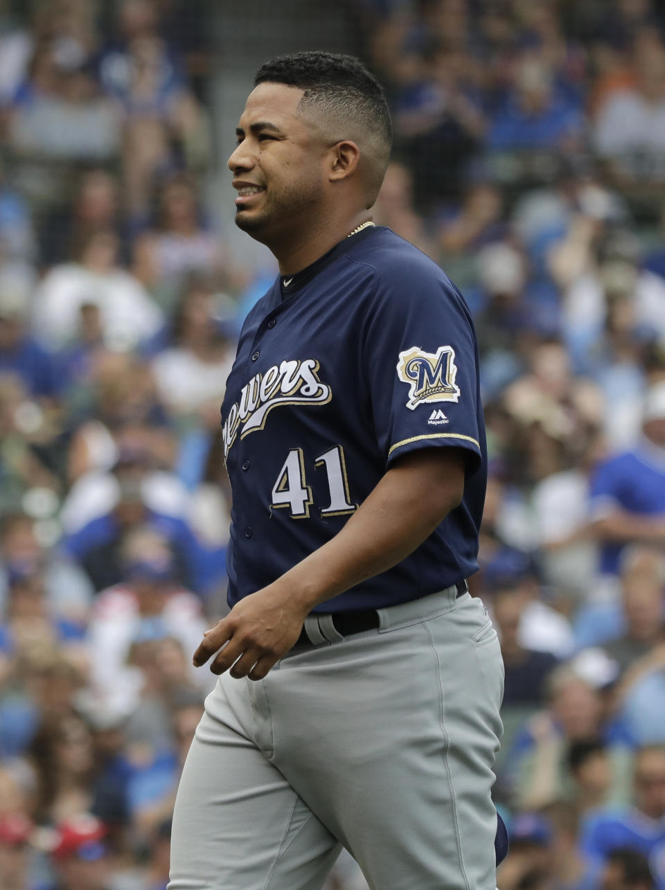 Milwaukee Brewers starting pitcher Junior Guerra reacts as he walks to the dugout after the first inning of a baseball game against the Chicago Cubs, Wednesday, Aug. 15, 2018, in Chicago. (AP Photo/Nam Y. Huh)