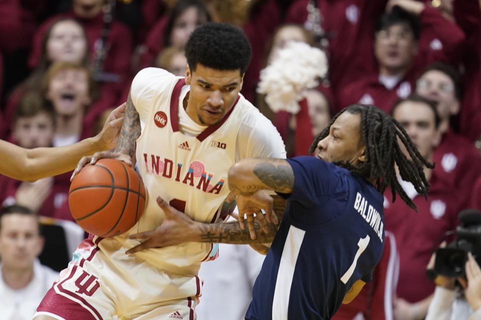Indiana's Kel'el Ware (1) goes to the basket against Penn State's Ace Baldwin Jr. (1) during the first half of an NCAA college basketball game, Saturday, Feb. 3, 2024, in Bloomington, Ind. (AP Photo/Darron Cummings)