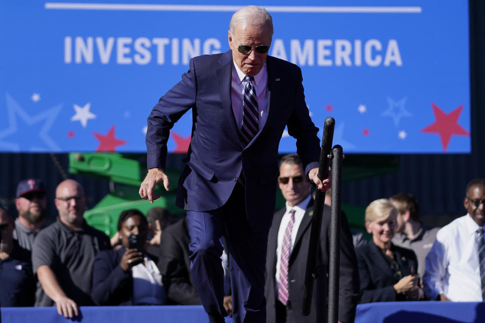 President Joe Biden stumbles on stage as he arrives to speak at Tioga Marine Terminal, Friday, Oct. 13, 2023, in Philadelphia. (AP Photo/Evan Vucci)