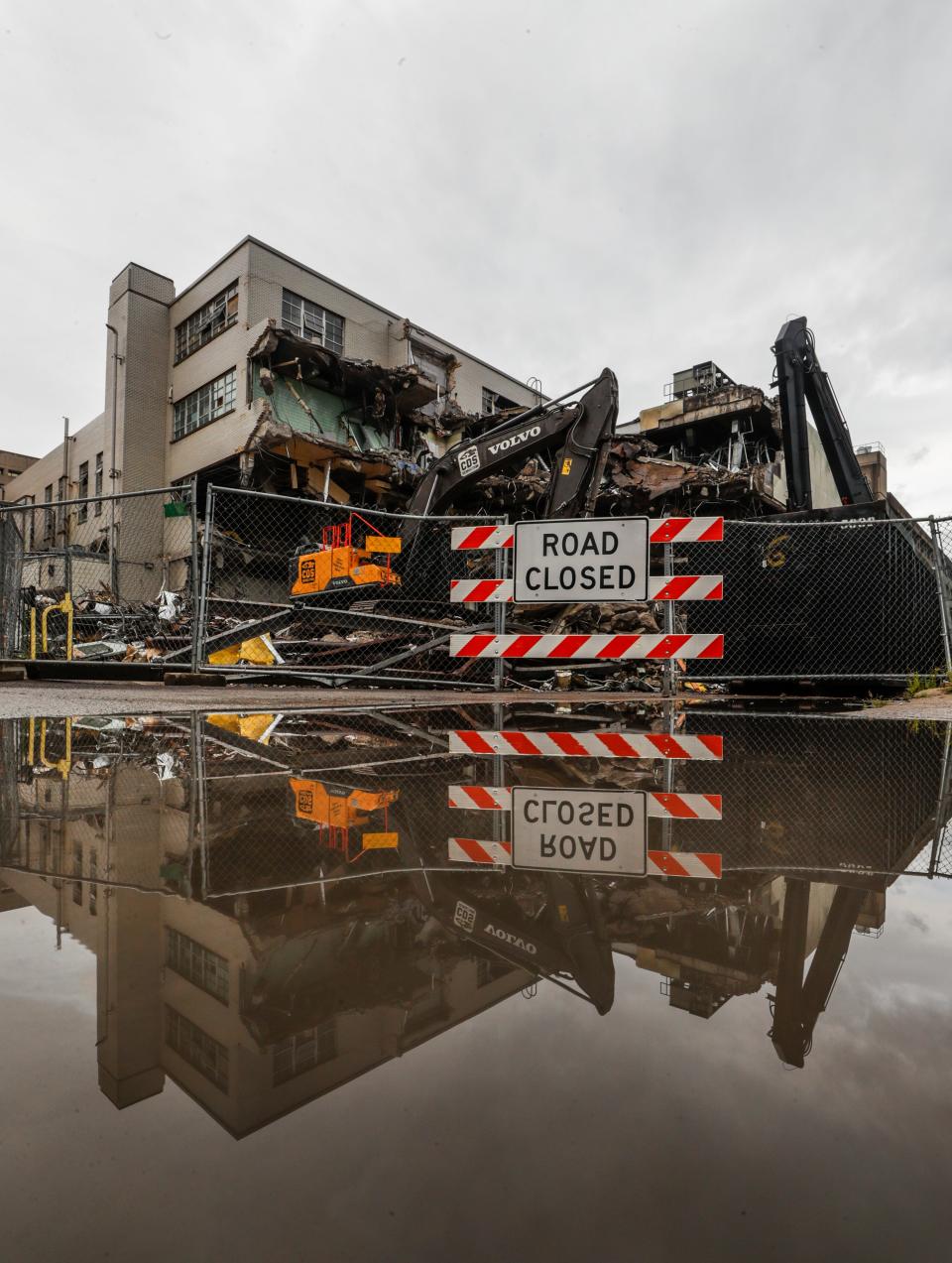 The old Louisville Metro Police headquarters at 7th and Jefferson undergoes demolition on Monday morning Aug. 14, 2023. The building was completed in 1955. The police will move into the vacant AT&T building located at 6th and West Chestnut.