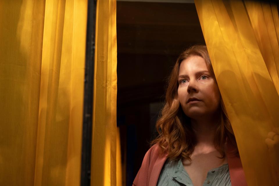 Amy Adams plays an agoraphobic psychologist who witnesses a bloody scene from across the street in the twisty thriller "The Woman in the Window."