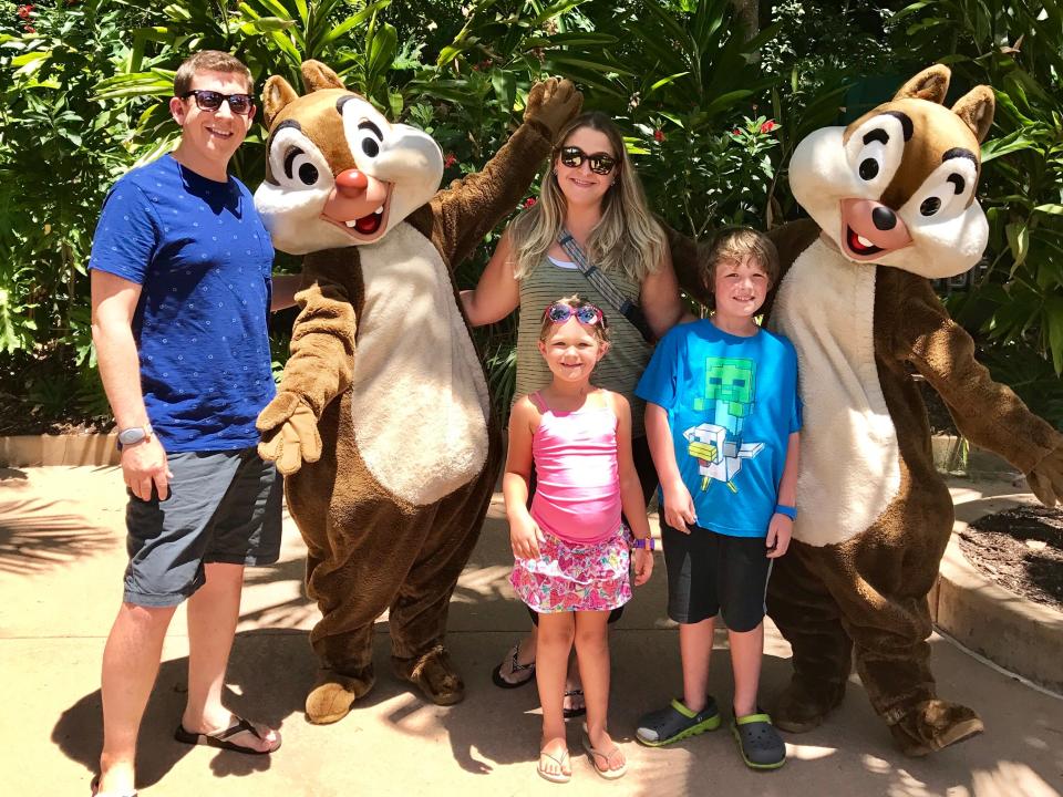 Terri Peters, her husband, and two kids, with chip and dale at disney world