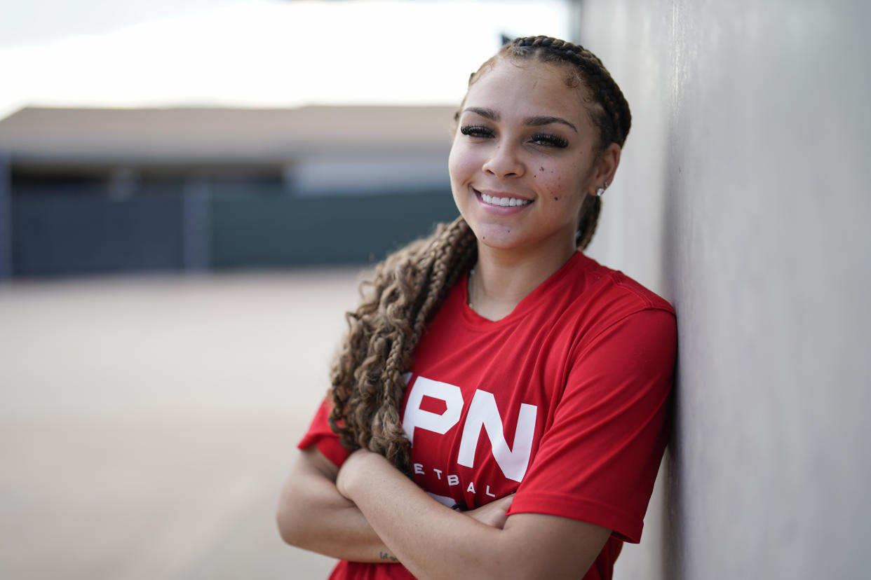 La Jolla Country Day high school basketball player Jada Williams poses for a portrait Monday, Sept. 12, 2022, in San Diego. Jada Williams has been a fixture on social media since she was 11 and stands out because of her flair for engagement. With the advent of NIL, she has parlayed her basketball skill and social media presence into six major endorsement deals that bring in a total of six figures a year. (AP Photo/Gregory Bull)