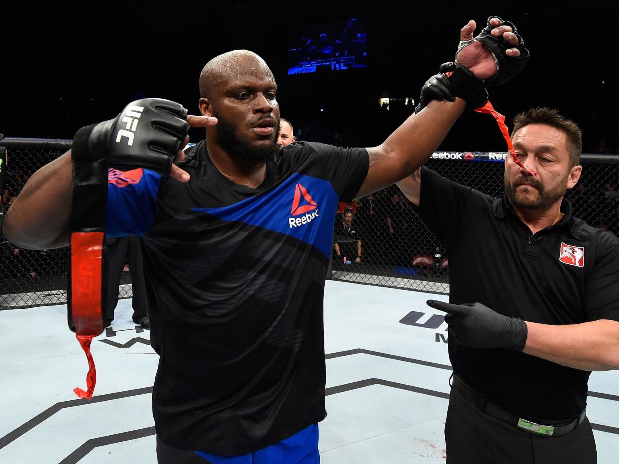 Derrick Lewis took time out of his training to help victims of Hurricane Harvey. (Getty)