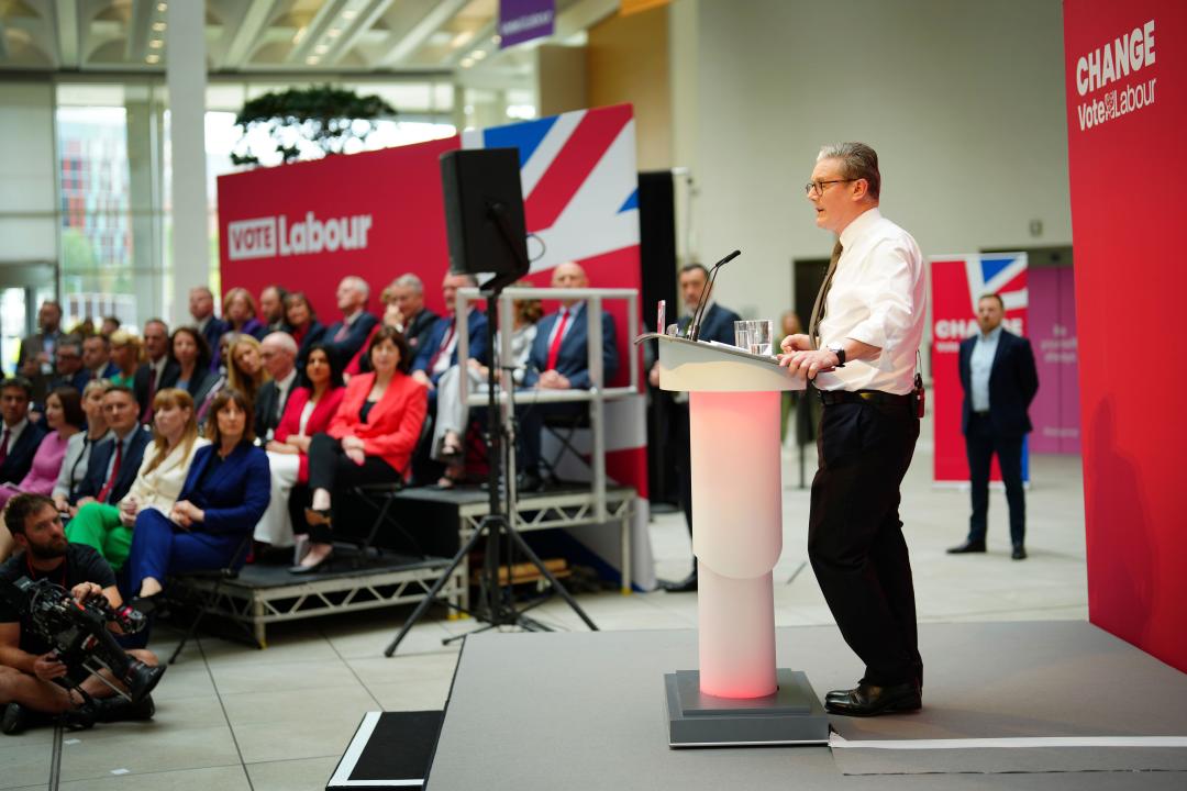 Britain's Labour Party leader Keir Starmer speaks on stage at the launch of The Labour party's 2024 general election manifesto in Manchester, England, Thursday, June 13, 2024. The election will take place on July 4. (AP Photo/Jon Super)