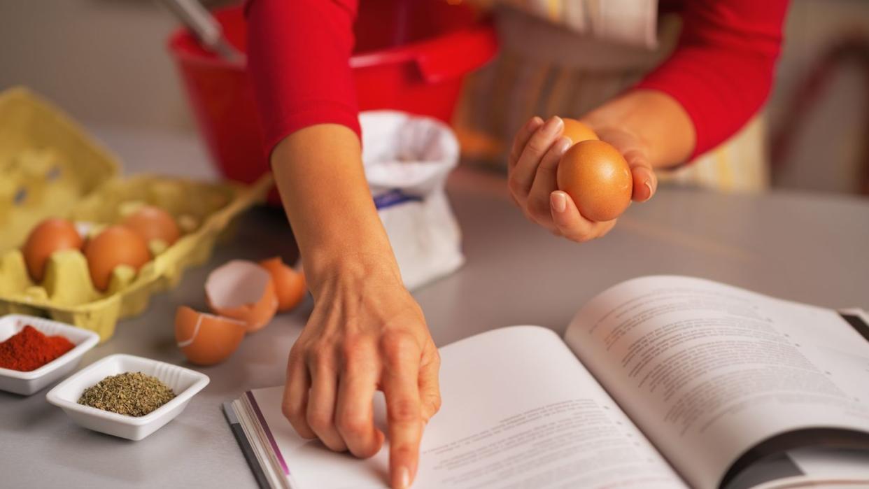 closeup on happy housewife preparing christmas dinner in kitchen