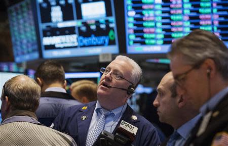 Traders work on the floor of the New York Stock Exchange February 28, 2014. REUTERS/Brendan McDermid