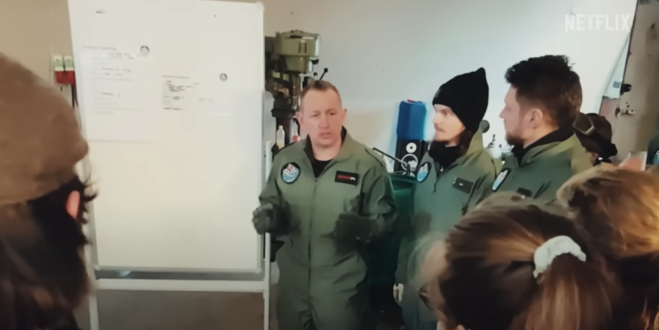 A man gives a presentation to a group of people