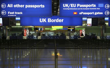 UK Border control is seen in Terminal 2 at Heathrow Airport in London June 4, 2014. REUTERS/Neil Hall