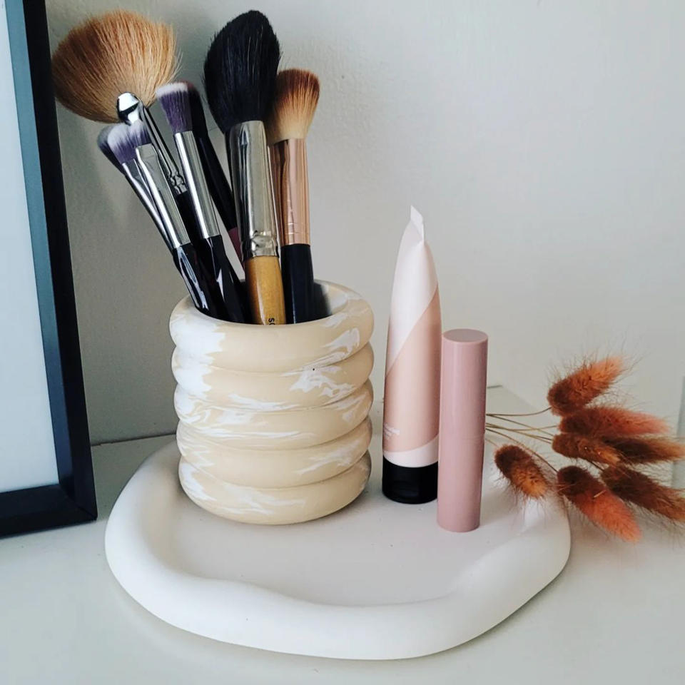 <p> It&#x2019;s always handy to have your makeup brushes easily accessible &#x2014; you&#x2019;ll find your morning routine so much easier if you&#x2019;re not rummaging through drawers for your favorite blusher brush. </p> <p> &quot;Consider using candle holders as a unique way to store makeup brushes,&quot; says Dino Ha, founder and CEO of MBX. &quot;Holders that are usually four inches deep and four inches wide are the ideal size. Whether you&apos;re looking for something to match the interior decor or to stay on trend with the holidays, it&apos;s a fun and foolproof way to store brushes and add some personality to your vanity. For the ultimate organization, use two candle holders to separate your eye brushes from face brushes.&quot; </p>