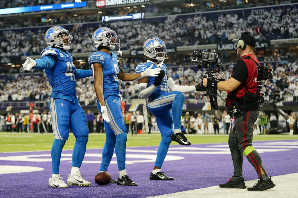 Detroit Lions safety Ifeatu Melifonwu (6) celebrates with teammates after intercepting a pass during the second half of an NFL football game against the Minnesota Vikings, Sunday, Dec. 24, 2023, in Minneapolis. The Lions won 30-24. (AP Photo/Abbie Parr)