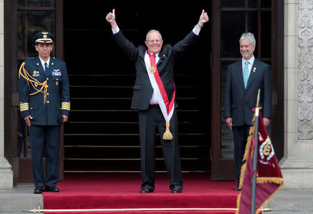Peru's President Pedro Pablo Kuczynski (C) gestures at the presidential palace after his inauguration ceremony in Lima, Peru, July 28, 2016. REUTERS/Guadalupe Pardo