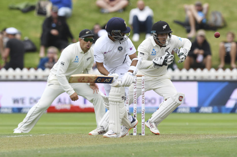 India's Ajinkya Rahane turns the ball past New Zealand's BJ Watling during the first cricket test between India and New Zealand at the Basin Reserve in Wellington, New Zealand, Friday, Feb. 21, 2020. (AP Photo/Ross Setford)