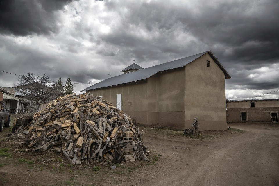 An exterior view of the 1760's Holy Rosary Mission church in Truchas, New Mexico, Friday, April 14, 2023. Hundreds of historic adobe churches like this survive in northern New Mexico, cared for by "mayordomos" even though Mass is celebrated there only a couple of times per year. (AP Photo/Roberto E. Rosales)