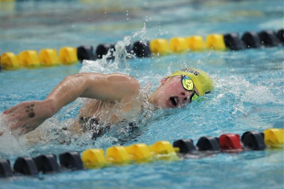 Delta girls swimming freshman Elle Groves competing in the 200yd freestyle race in the team's meet at Delta High School on Monday, Dec. 5, 2022.