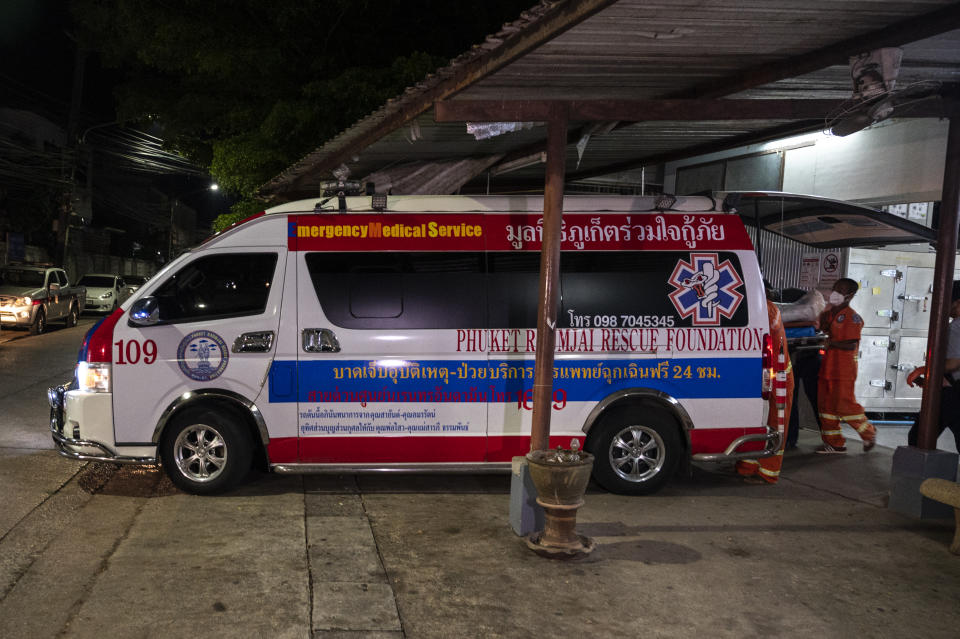 Health workers, pictured here loading the body of Shane Warne onto an ambulance for departure from the morgue at Suratthani Hospital to Bangkok.