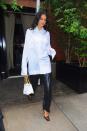 <p>Jenner ticked all the trends in an oversized shirt, leather trousers and square-toed heels.</p>