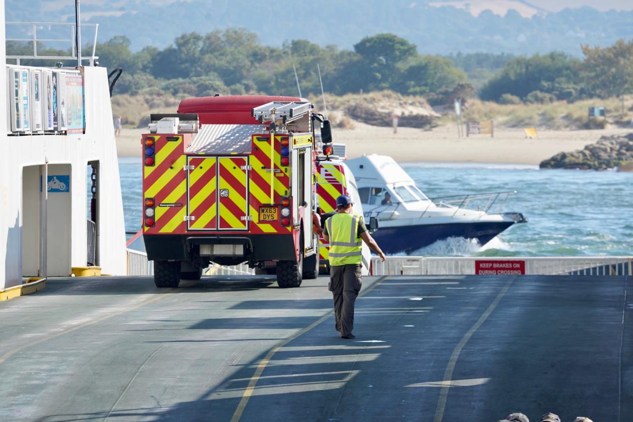 A fire engine on a chain ferry heading to the scene of a fire on Studland Heath, Dorset, as a drought has been declared for parts of England following the driest summer for 50 years. Picture date: Friday August 12, 2022.