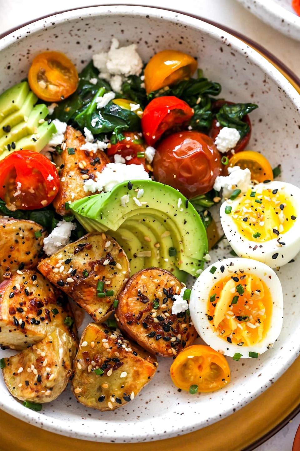 Loaded with potatoes, eggs, roasted tomato, spinach, and avocado then dusted with everything but the bagel seasoning, these hearty breakfast bowls will keep you feeling satiated all morning.Recipe:&nbsp;Savory Breakfast Bowls