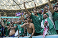 Saudi Arabia's fans celebrate their victory after the World Cup group C soccer match between Argentina and Saudi Arabia at the Lusail Stadium in Lusail, Qatar, Tuesday, Nov. 22, 2022. (AP Photo/Jorge Saenz)