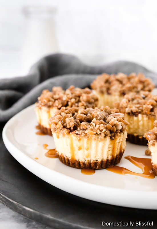 <p>Domestically Blissful</p><p>These mini apple cheesecakes have a cinnamon graham cracker base, a creamy cheesecake layer, topped with cinnamon apples, and a crumbly streusel topping.</p><p><strong>Get the recipe: <a href="https://domesticallyblissful.com/mini-apple-cheesecakes/" rel="nofollow noopener" target="_blank" data-ylk="slk:Domestically Blissful;elm:context_link;itc:0;sec:content-canvas" class="link ">Domestically Blissful</a></strong></p>