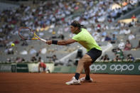 Spain's Rafael Nadal reruns the ball to Serbia's Novak Djokovic during their semifinal match of the French Open tennis tournament at the Roland Garros stadium Friday, June 11, 2021 in Paris. (AP Photo/Christophe Ena)