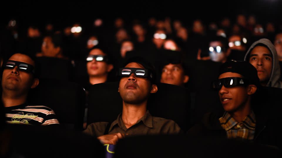 Venezuelan filmgoers watch the first screening in Venezuela of Marvel Studios' "Avengers: Endgame" at a cinema in Caracas on early April 26, 2019. - Federico Parra/AFP/Getty Images