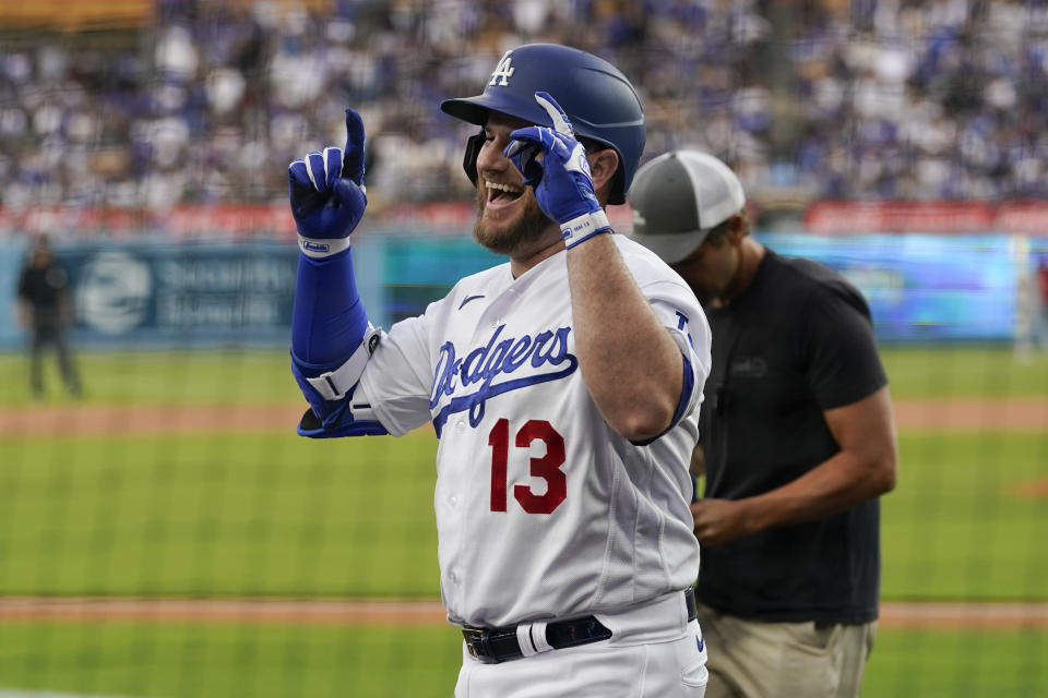 Los Angeles Dodgers' Max Muncy (13) celebrates after hitting a home run during the first inning of a baseball game against the Minnesota Twins in Los Angeles, Monday, May 15, 2023. (AP Photo/Ashley Landis)