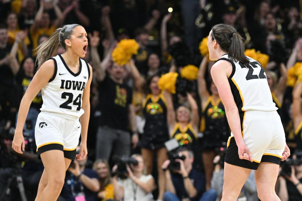 Iowa's Caitlin Clark (22) and Gabbie Marshall (24) react during a game against Ohio State at Carver-Hawkeye Arena.