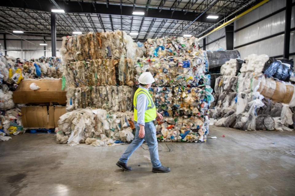 Brightmark CEO, Bob Powell, who proclaims himself as an environmental steward, looks over bales of plastic in Ashley, Indiana.