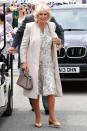 <p>The Duchess of Cornwall wore a printed ivory dress, a light pink coat, and carried a gray purse while attending the Royal Cornwall Show in Wadebridge, England.</p>
